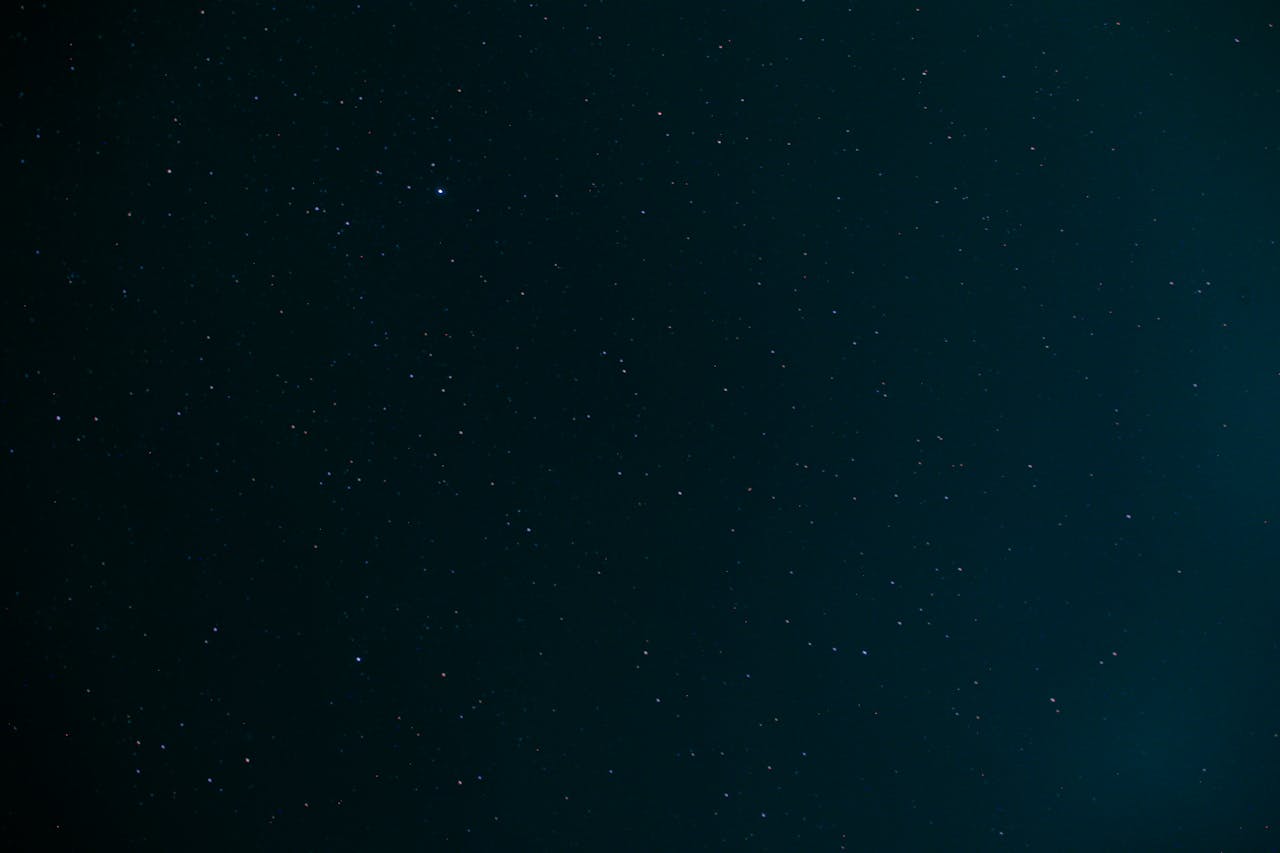 about-02 A serene starry night sky with countless distant stars visible against a dark backdrop.